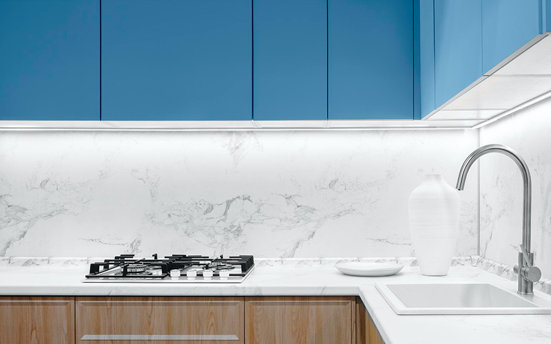 Modern kitchen marble backsplash requiring regular cleaning of old stains