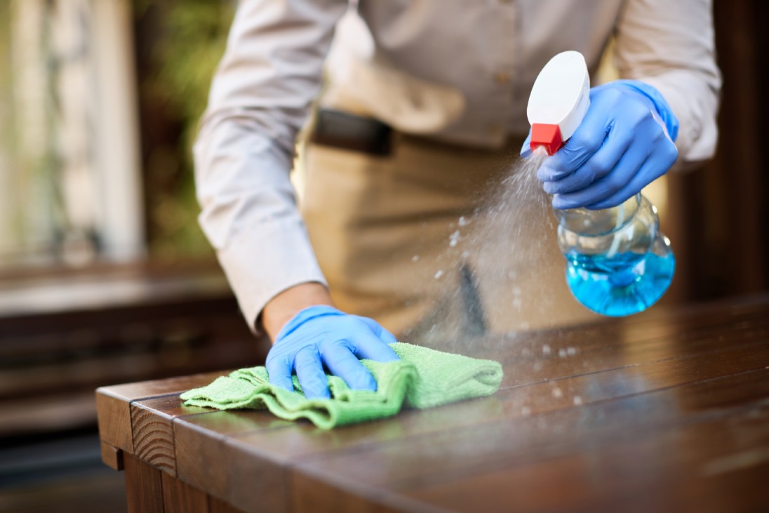 Waitress disinfecting